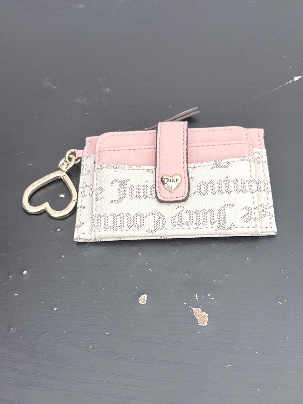 Juicy Couture pink & white wallet with repeating black 'Juicy Couture' text